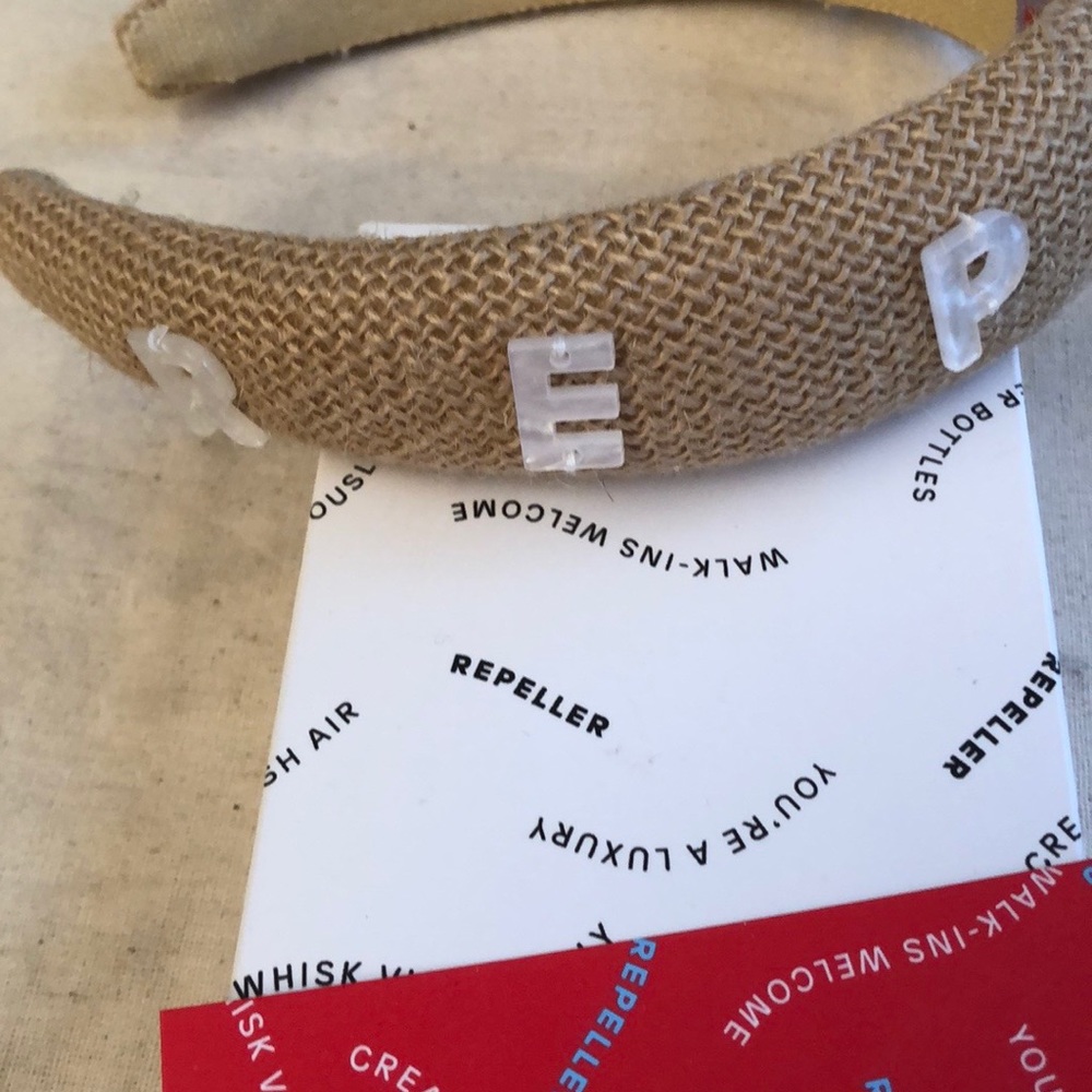 New with tags Man Repeller headband